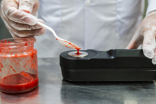 Worker using Digital Refractometer 