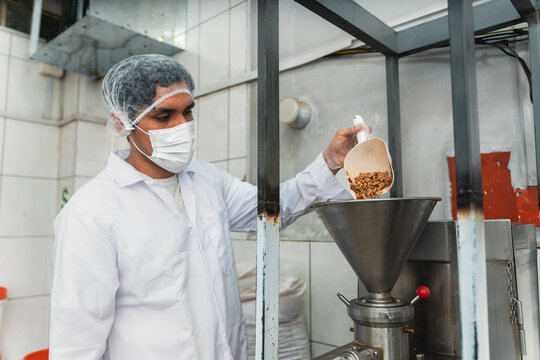 Man Processing Peanuts