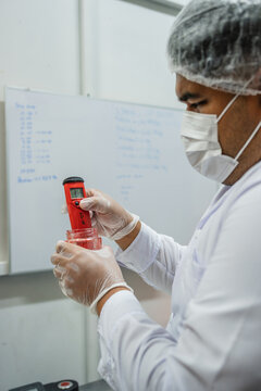 Scientist Measuring Ph