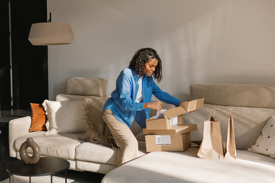 Woman Online Shopping Unboxing at Home