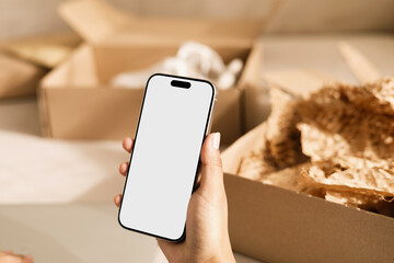 Mockup Phone with white screen and Unboxing package at Modern Home