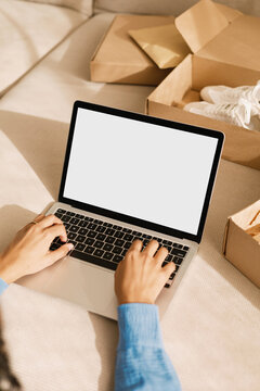 Mockup Laptop with white screen E-commerce Lifecycle: From Box to Blog