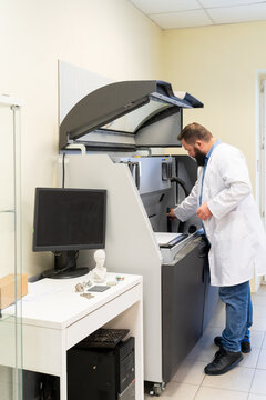 Researcher Using 3D Printer in Laboratory Room