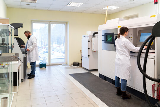 Scientists Using 3D Printer in Laboratory Room