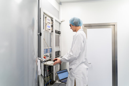 Scientist Using Electron Beam Evaporation System In Clean Room