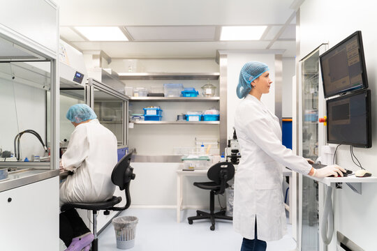 Scientists Working In Optical Coatings Laboratory