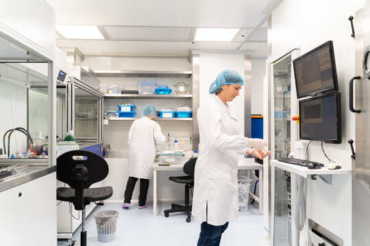 Researchers Working In Optical Coatings Laboratory