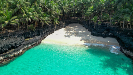 Amazing Bateria beach with palm trees and turqoise water in ilheu das rolas, Sao tome, Africa