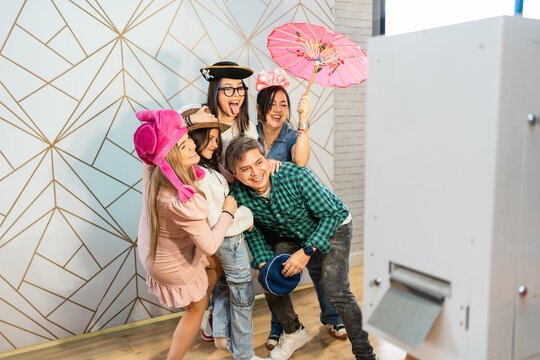 Family in a photo booth at a party.