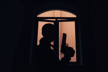 woman holding a pistol