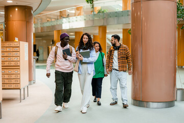 Students walk through the hall of the university
