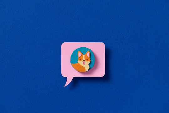 Dog with speech bubble isolated in paper cut style