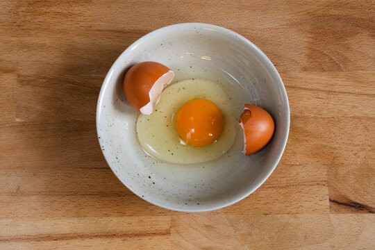 Chicken egg in plate.