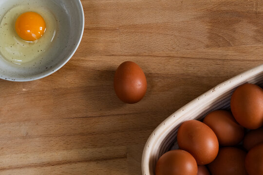 Preparing to cooking desserts.
Chicken eggs on the wooden table.