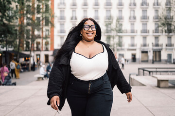 Happy and empowered plus size woman