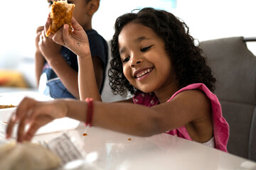 Toddler eating fired chicken