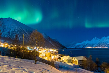Northern Lights over a remote village in the Norwegian Fjords
