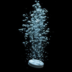 Effervescent pill fizzy bubbles in water, realistic soluble tablet falling down and dissolving with sparkling fizzy bubbles in water