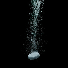 Realistic effervescent pill with fizzy bubbles dissolving in water. Soluble tablet pill with sparkling fizzy bubbles stream