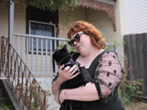 Woman adoring her pet cat