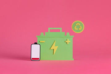 Paper cut Car battery icon isolated on pink background