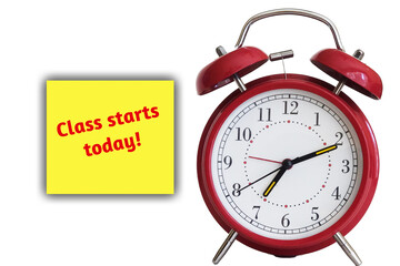 Vintage red alarm clock with a class starts today sticker