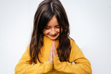 Happy Girl with Hands Together in Namasté Yoga greeting