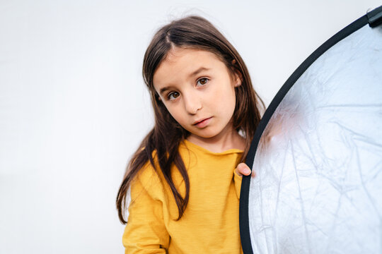 Tween girl Portrait posing with Photography Reflector