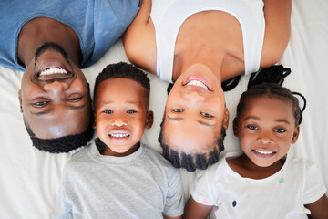 Black family, top view and portrait to relax on bed for bonding, love and care for smile on...