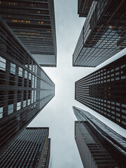 skyscrapers from bottom up showing an upside down perspective to the sky