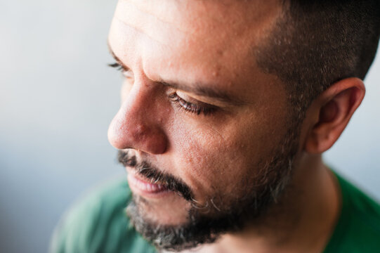 Melancholic man close up portrait