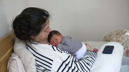 Tired Mother and Newborn Asleep Together During Afternoon Nap - Struggling with Fatigue in the First Week of Maternal Care