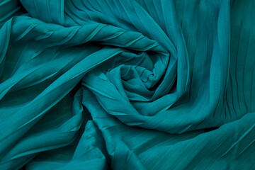 Teal blue fabric overlapping pattern on the center