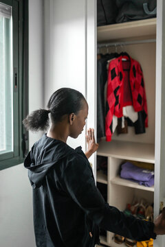 black woman organizing at home