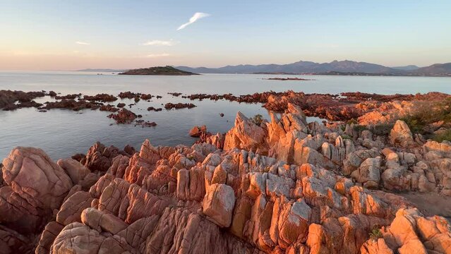 Static footage of rocky Conca del Tramonto Beach in a serene moment at dawn with seascape and cliffs