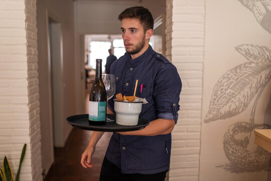 Waiter serving a tray in a restaurant