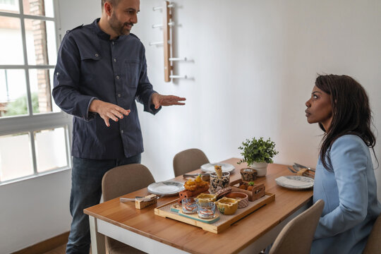 waiter serving customer in a restaurant