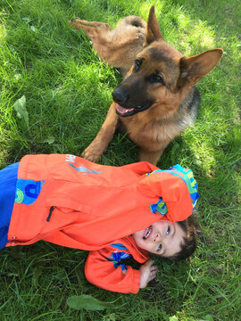 Boy playing with his dog
