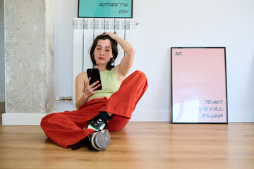 Woman engaged with smartphone indoors