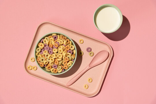 Colorful rings / loops breakfast cereal on pink background
