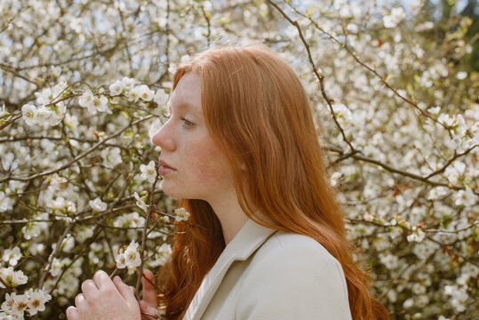 Profile of teenager with red hair and freckles