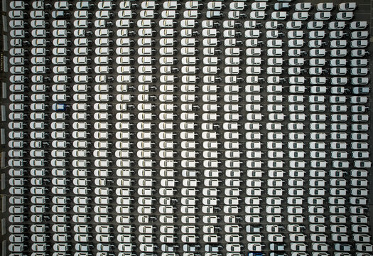 Pickup utility vehicle imports - new cars parked, aerial overhead