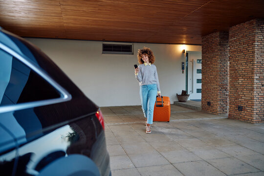 Smiling young woman going on a trip