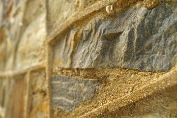 Close Up of Stone Wall Covered in Sand