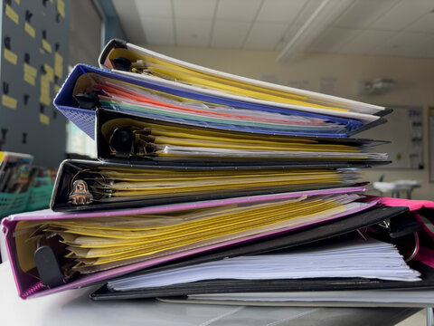 Stack of Notebooks with nobody in school classroom 