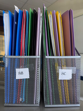 Stack of Notebooks with nobody in container in school classroom