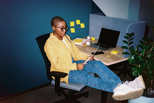 Woman analyzing document at office 