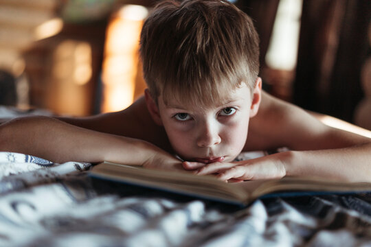 A Tired Little Boy with a Book