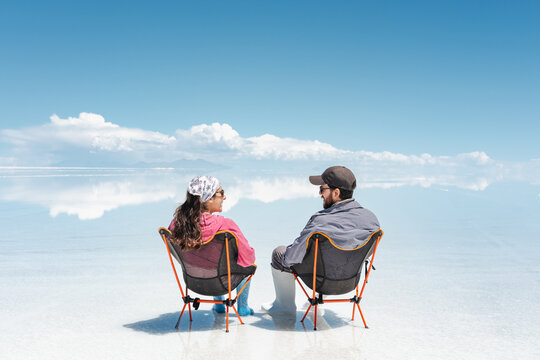 travel Couple Relaxing in amazing landscape