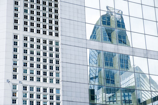 a reflection of a futuristic tower.